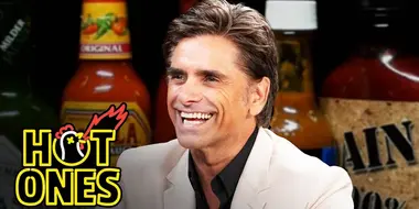 John Stamos Falls Out of His Chair While Eating Spicy Wings