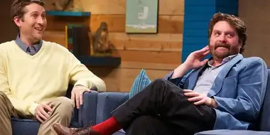 Zach Galifianakis Wears a Blue Jacket & Red Socks